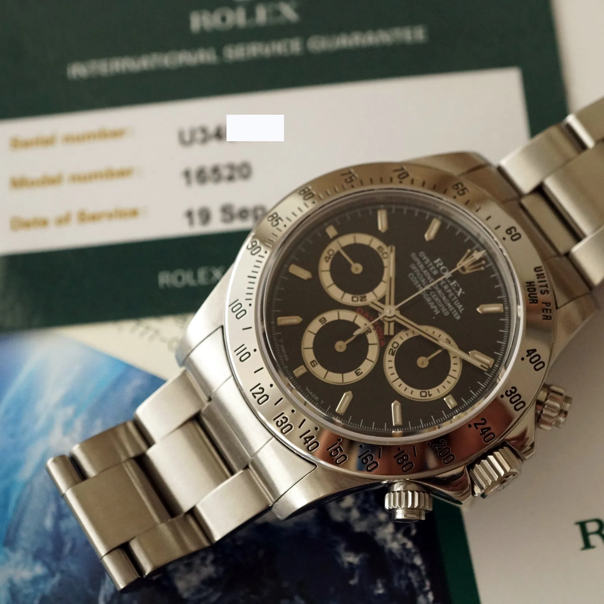 1997 ROLEX COSMOGRAPH BLACK DAYTONA REF.16520 / RSC SERVICED CARD