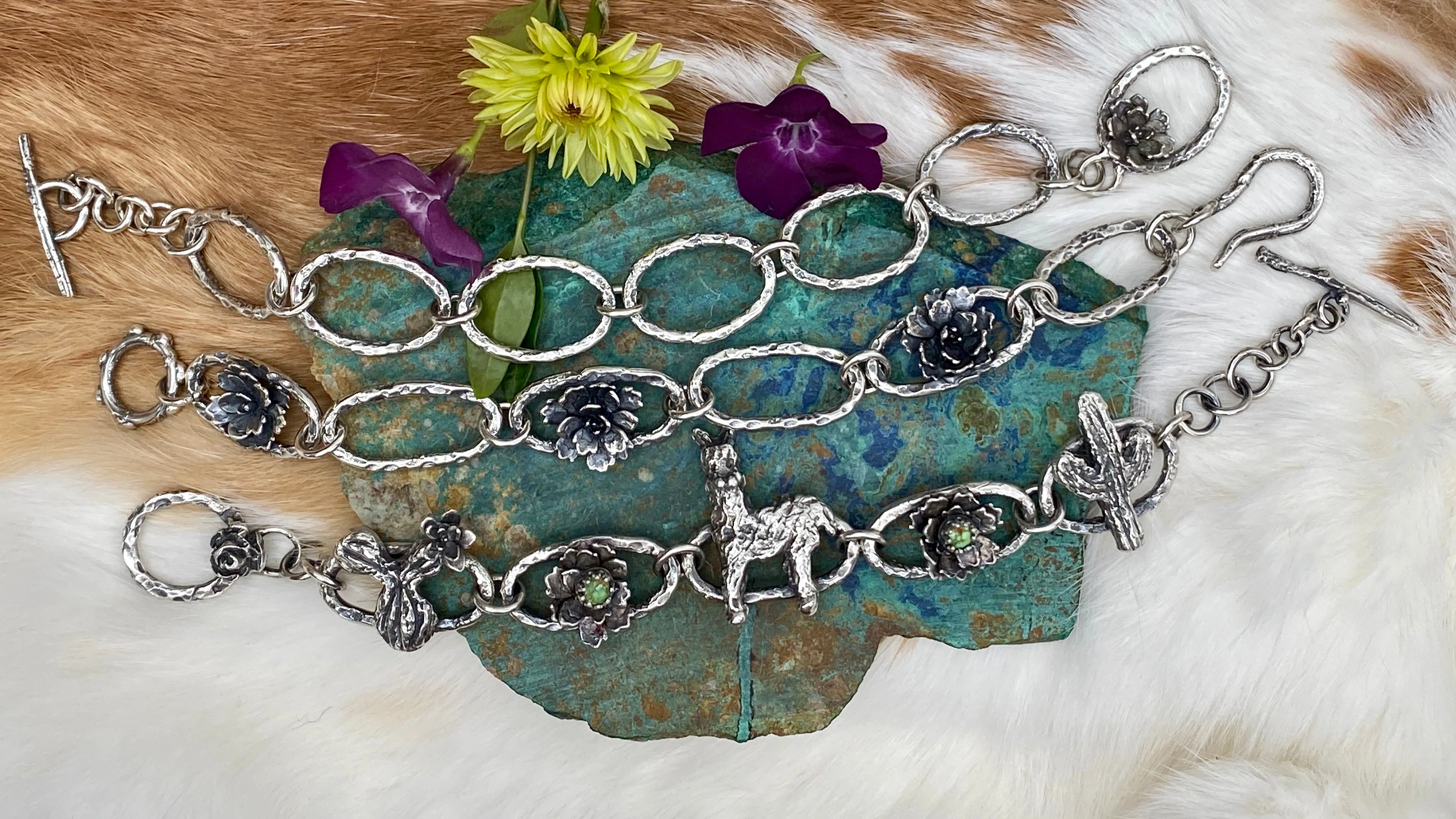 Hammered ovals with Succulent blooms. Hand cast sterling silver bracelet