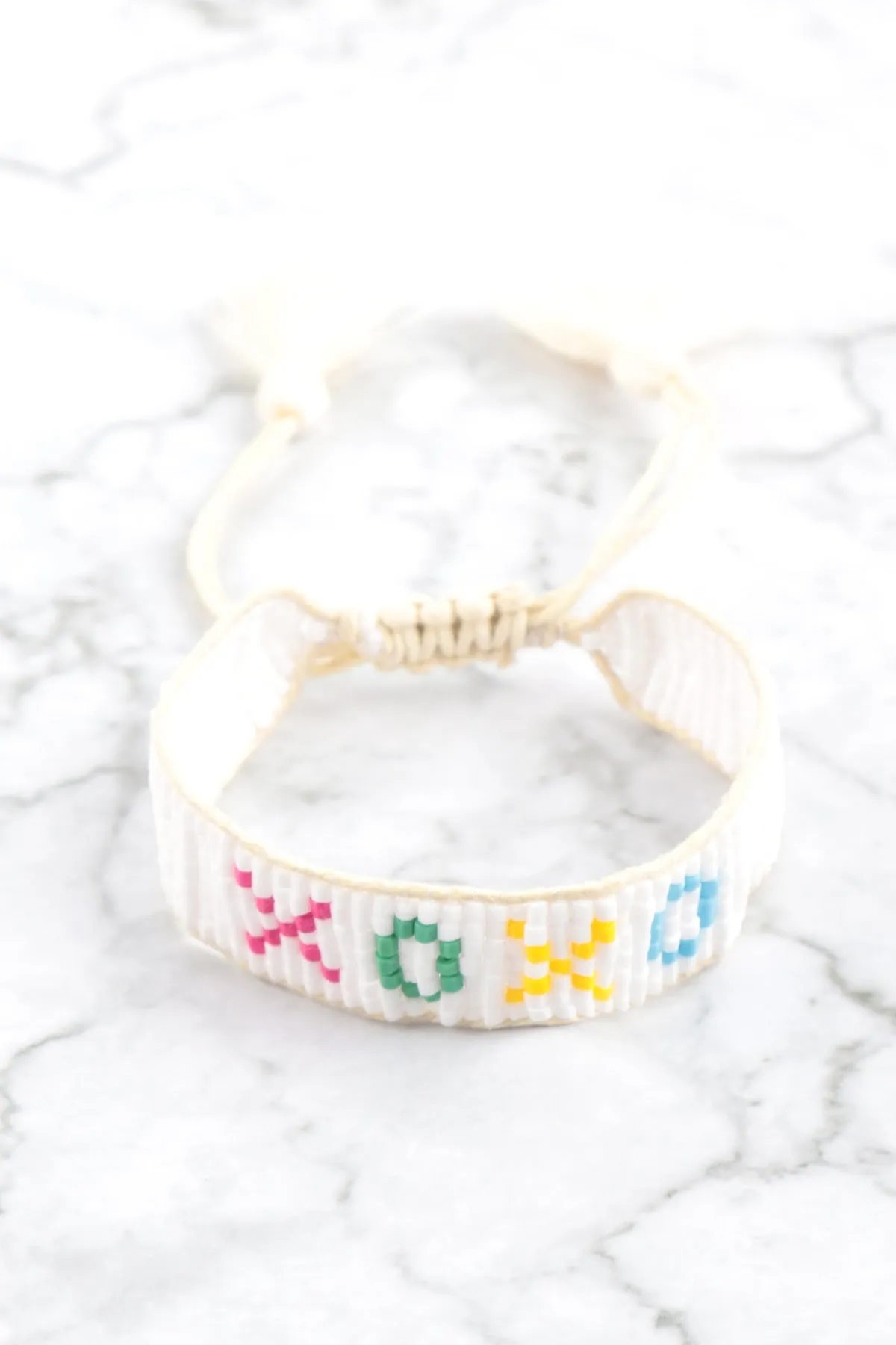XOXO SEED BEADS PULL TIE BRACELET